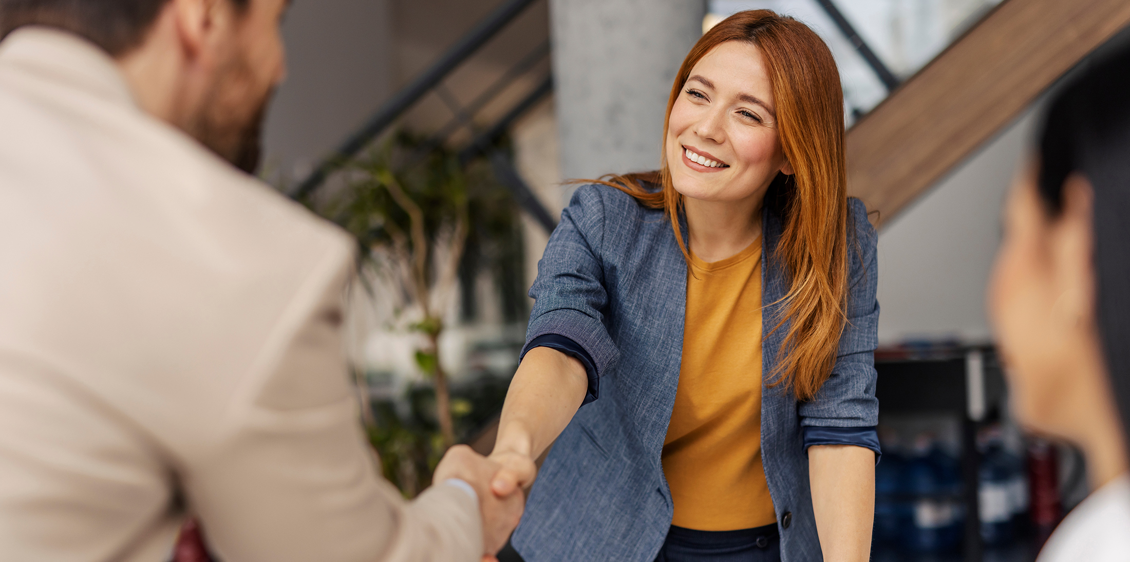 smiling designer handshake