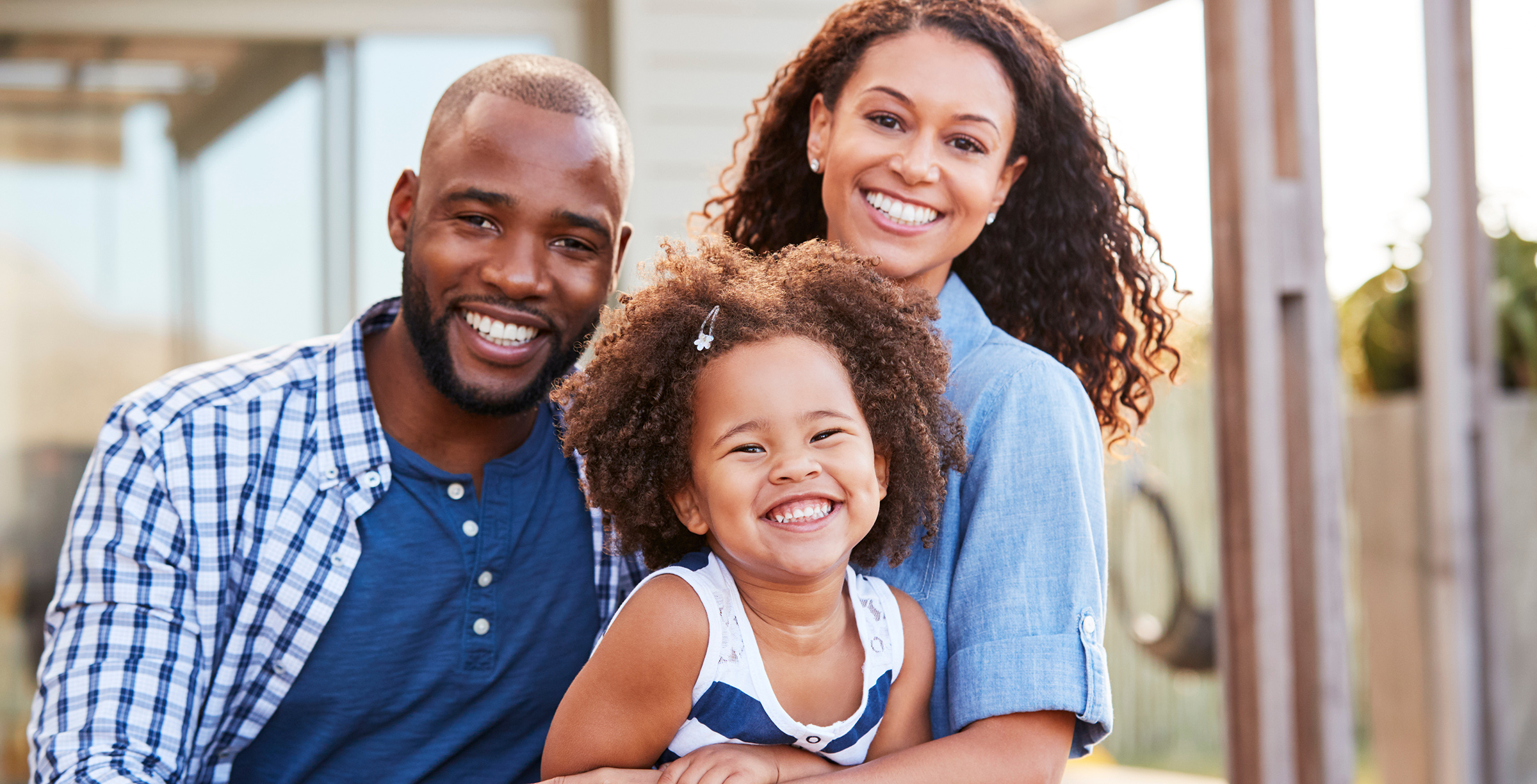 smiling-family-home-backyard-rock-plus-stone-va
